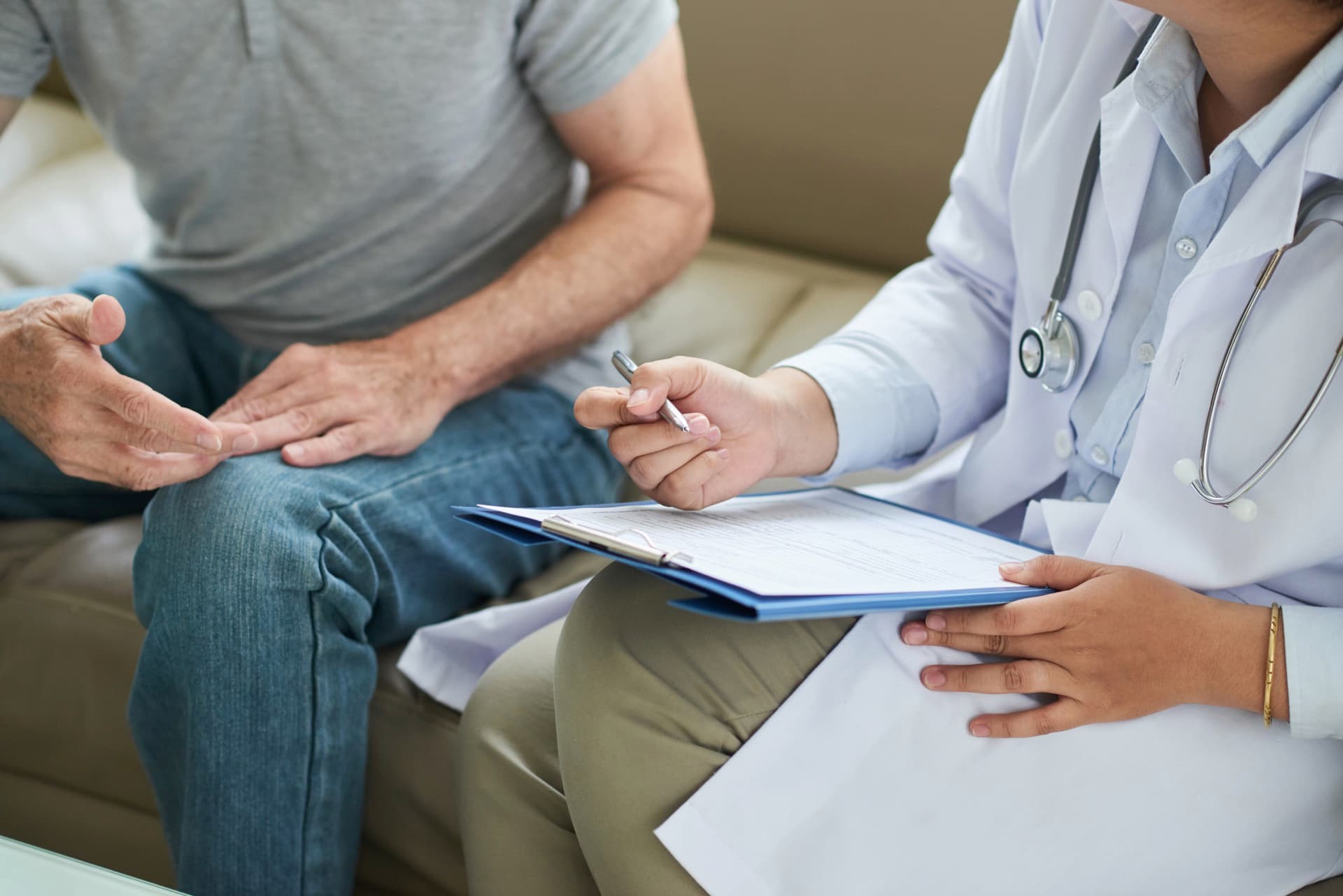 A clinician and patient reviewing previous treatment notes together